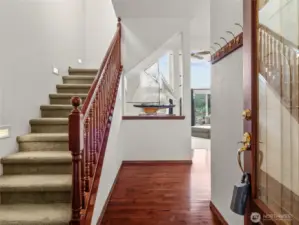 Upstairs to primary bed & bath.