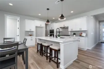 Photos are of a home in a different community and are for illustration purposes only to reflect typical finishes.  May depict seller enhancements.  Colors and options may vary.