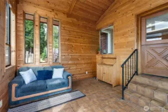 Sunroom with entry to kitchen on right.