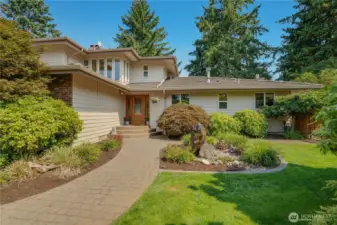 This 3-level Fircrest home with 6 bedrooms, an office, bonus room, and 5 different bathrooms is ready for you to move in, stretch out, relax on the porch swing, and snuggle by the fireside.