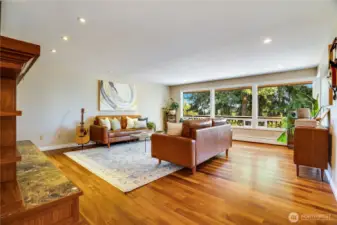 Take the hall past the dining room to the formal living room. Set aside from the activity of the kitchen and family room, this is another cozy place to enjoy the fireside.
