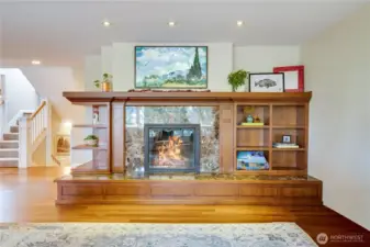Built-ins and a wide hearth surround the gas fireplace with a wraparound mantel above. Along with the fireplaces, a brand new boiler keeps the whole house cozy.
