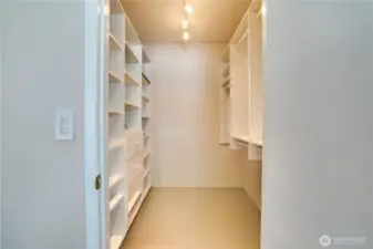 The walk-in closets include shelving and drawers to help keep items tidy and organized.
