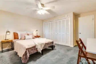The downstairs bedrooms overlook the patio and the fenced back yard.