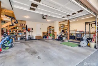 This 1,000 sq ft 3-car garage features an electric vehicle charger, parking area, and room to store bikes and tools, or set up exercise equipment. Don't forget there's a large storage space downstairs as well.