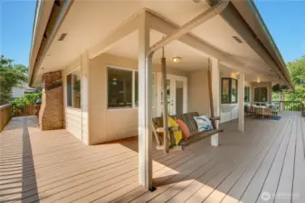 Comfort and space define this home with its hardwood floor, multiple fireplaces, wraparound deck, and room for everyone to gather together.