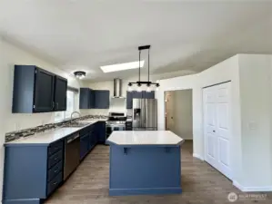 Sleek kitchen with newer stainless-steel appliances.