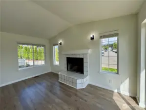 Cozy dining space highlighted by the wood-burning fireplace.