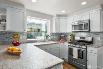 Slab granite countertops and stainless steel appliances