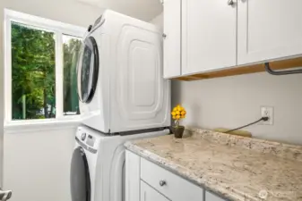 Laundry room with cabinets and folding area