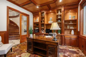 Profession office, wood wrapped with custom shelving and beautiful red Onyx flooring