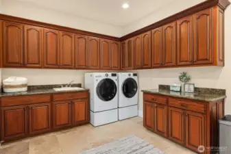 Amazing laundry room! love all the cabinetry and counter space!