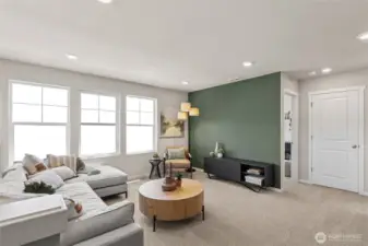 Large loft area perfect for media space, game room, or playroom. Actual home is under construction and finishes, materials, and colors will vary. See site agent for details.