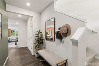 Large foyer perfect for a bench or coat rack. Actual home is under construction and finishes, materials, and colors will vary. See site agent for details.