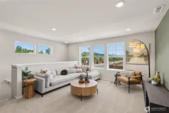 Large loft area perfect for media space, game room, or playroom. Actual home is under construction and finishes, materials, and colors will vary. See site agent for details.