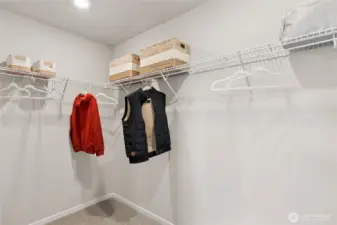 Large walk-in closet off primary bedroom. Actual home is under construction and finishes, colors, and materials may vary. See site agent for details.