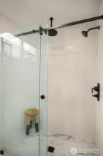 Full tile surround- sliding glass door entry, & rainfall shower head. A true luxury experience found in the owners suite