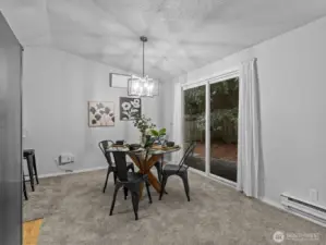 Nearby the kitchen is the dining area with access to the back patio.