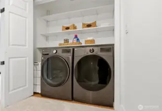 In-unit laundry area with washer and dryer