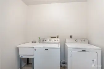 Laundry room with utility sink.