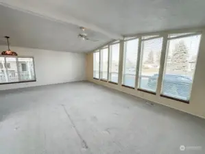 Living room w/ plenty of natural light.