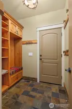 Built-ins in mudroom off of 3 car garage