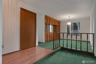 Entrance leads to formal dining room with built China cabinets.