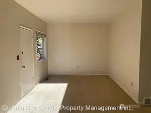 Front entry door and living room.