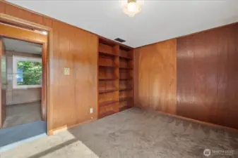 Beautiful built in shelving in front bedroom