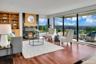 Built ins, fireplace, floor to ceiling windows
