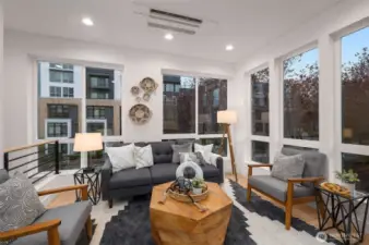 Welcome home to expansive windows, designer finishes & warm, west-facing light.