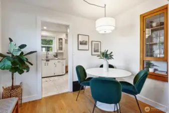 Dining room features original wood built-ins with leaded glass door.