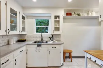 Sunny south-facing kitchen with solid wood cabinetry.