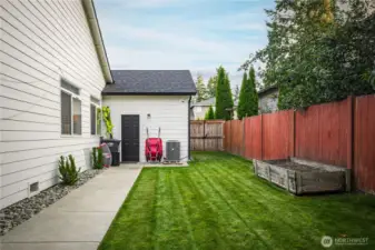 Backyard access to the spacious 3-car garage adds convenience.