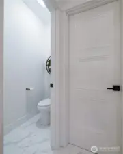 A walk-in closet and private WC complete the primary bath.
