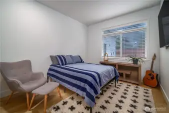 The second additional bedroom with abundant natural light and storage.