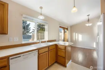 Kitchen view into the dining room with access to the large deck