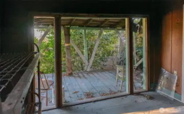Living area of cabin to deck which is facing the view.