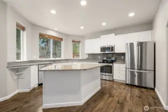 Kitchen with Granite Countertops, Island Eating Space & SS Appliances
