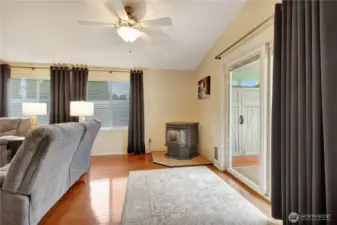Pellet stove in the corner with access to the back porch!