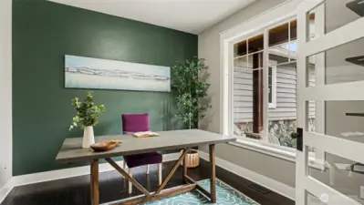 The main floor office features French doors and views of the front yard & porch.