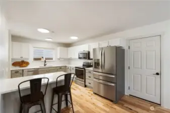 Fully remodeled kitchen with quartz & stainless appliances.