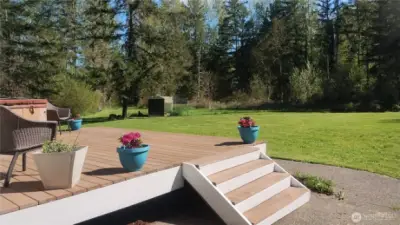 Deck off the primary bedroom with hot tub.    The north side of the property has a large fenced area for chickens.  The well head is located in this area as well