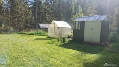 The well head is near the chicken coop and greenhouse.