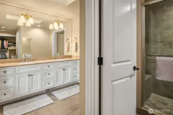 The 5-pieces en suite bath features a skylight, dual vanity with granite counters, heated tile floors, oversized shower with body jets, bench and nook, a deep jetted tub and a huge walk-in closet with a circular layout providing two accesses to this space.