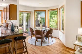The breakfast nook leads out via the sliding door to the backyard deck, storage unit and yard.