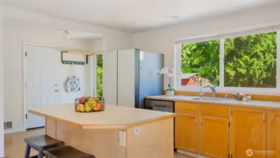 That kitchen island you’ve been dreaming about? It’s right here, ready for meal prep, baking marathons, or morning coffee chats. A large window over the sink frames a clear view of the backyard, so you can stay connected to the action outside while getting things done inside.