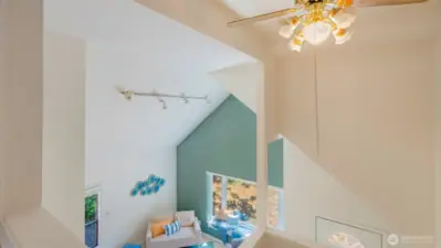 Pause at the top of the stairs and take it all in - the view looking down shows off the kind of detail that sets this home apart. It’s not your everyday layout, and that’s exactly what makes it feel so special.