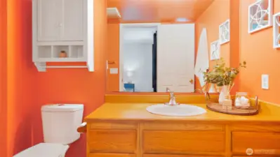 The bold orange energy of this ensuite brings instant sunshine - no matter what the weather’s doing outside. It’s bright, it’s fun, and it’s guaranteed to start your day with a smile.