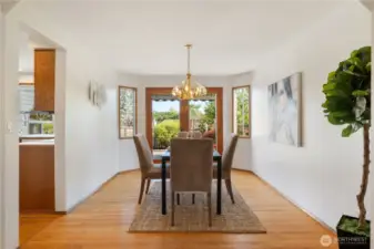 Beautiful wood french doors off the dining room lead to additional entertaining area.
